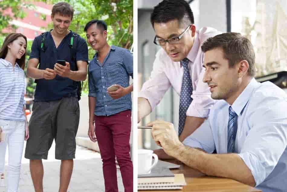 asian-couple-caucasian-looking-at-smart-phone-business-executives-laptop